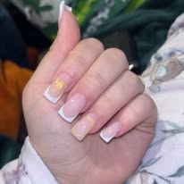 White French tips with gold glitter feature nail